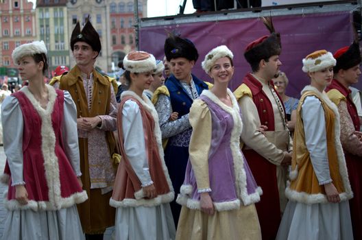 WROCLAW, POLAND - JUNE 15:  Members of Folk Dance group "Jedliniok" prepare for performance on stage on June 15, 2012 in Wroclaw.  