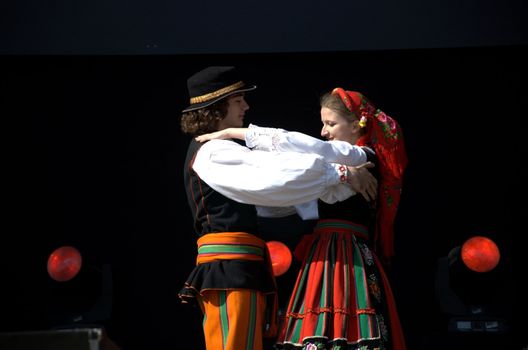 WROCLAW, POLAND - JUNE 15:  Members of Folk Dance group "Wroclaw" perform on Euro 2012 fanzone stage on June 15, 2012 in Wroclaw.  