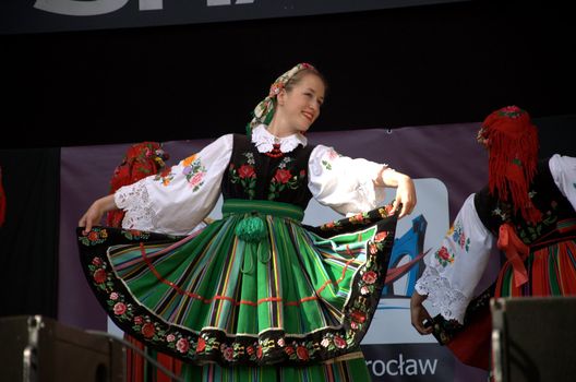 WROCLAW, POLAND - JUNE 15:  Members of Folk Dance group "Wroclaw" perform on Euro 2012 fanzone stage on June 15, 2012 in Wroclaw.  