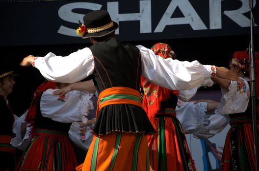 WROCLAW, POLAND - JUNE 15:  Members of Folk Dance group "Wroclaw" perform on Euro 2012 fanzone stage on June 15, 2012 in Wroclaw.  