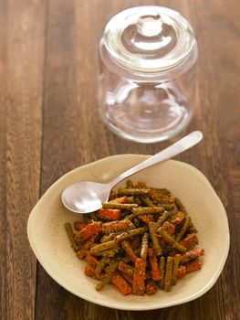 close up of a bowl of indian carrot and bean pickle