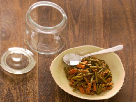 close up of a bowl of indian carrot and bean pickle