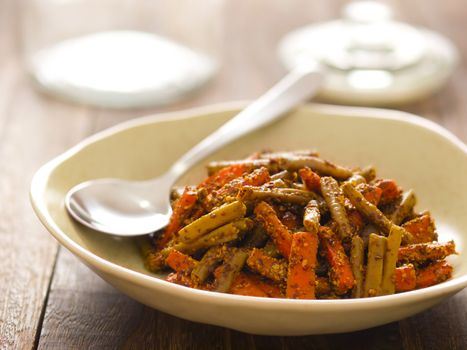 close up of a bowl of indian carrot and bean pickle