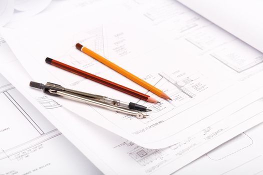 Tools and papers with sketches on the table