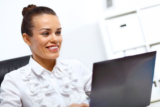 Young manager working with notebook in the office