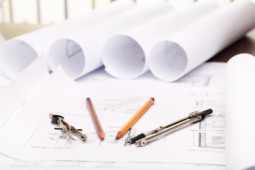 Tools and papers with sketches on the table