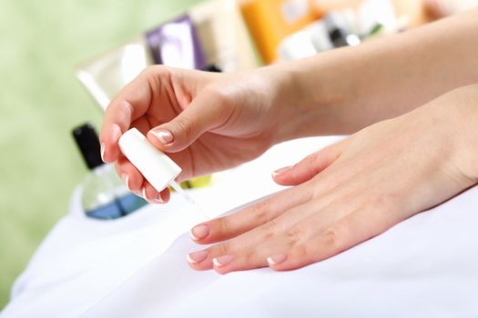 Female hands and manicure related objects in spa salon