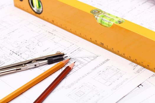 Tools and papers with sketches on the table