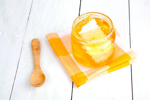 honey with a wooden spoon