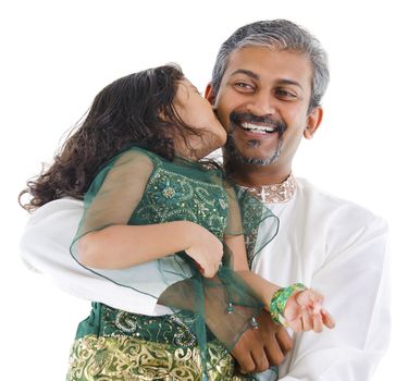 Happy little Indian daughter kissing her father on white background