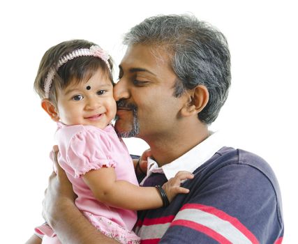 Mature Indian father kissing baby girl, isolated on white background