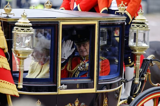 LONDON, UK - June 16: Queen Elizabeth II and the Duke of Edinburgh during Trooping the Colour ceremony on the Mall and at Buckingham Palace, on June 16, 2012 in London. Trooping the Colour takes place every year in June to officialy celebrate the sovereign birthday.