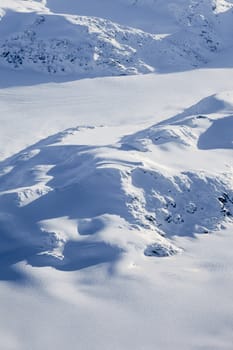 Snow covered mountain peaks perfect for heli-skiing in British Columbia, Canada.