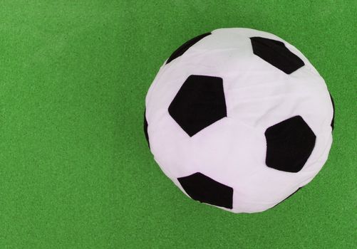 soccer ball with green cork board