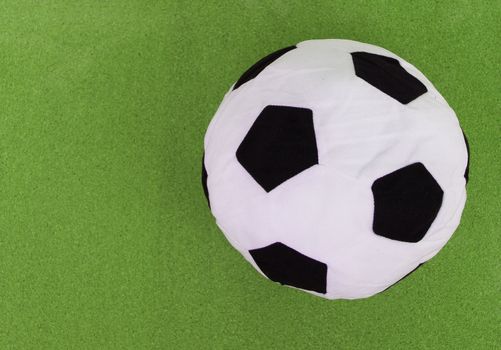 soccer ball with green cork board