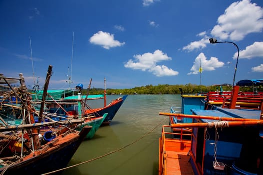 Scene of fishing boats at a port in Thailand