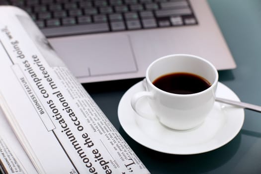 Image of business table with a cup of coffee and norebook