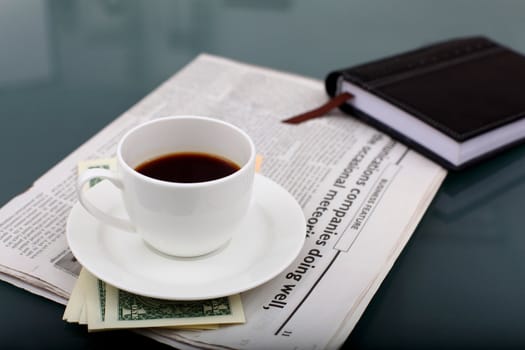 Image of business table with a cup of coffee and norebook