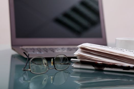 Image of business table with a cup of coffee and norebook