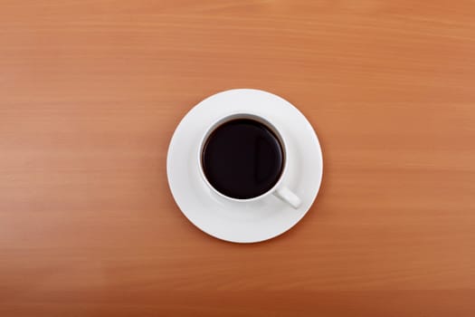 Cup of black coffee in a white cup