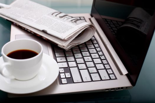 Image of business table with a cup of coffee and norebook