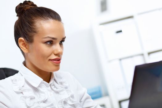 Young manager working with notebook in the office