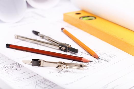 Tools and papers with sketches on the table