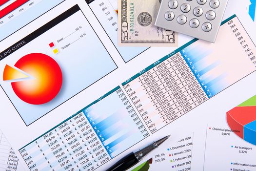 Financial paper charts and graphs on the table