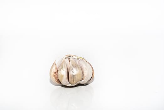 Garlic vegetable closeup isolated on white background