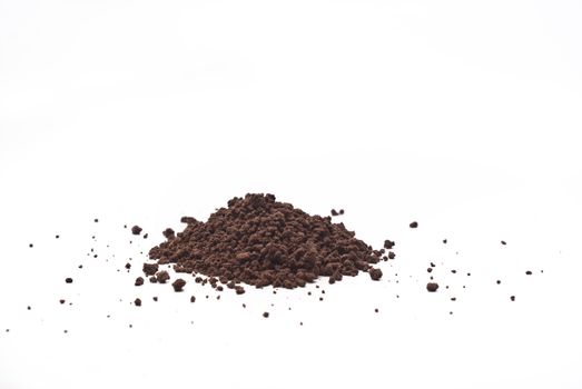 Grains and cocoa powder on a white background.