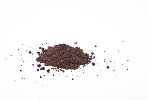 Grains and cocoa powder on a white background.