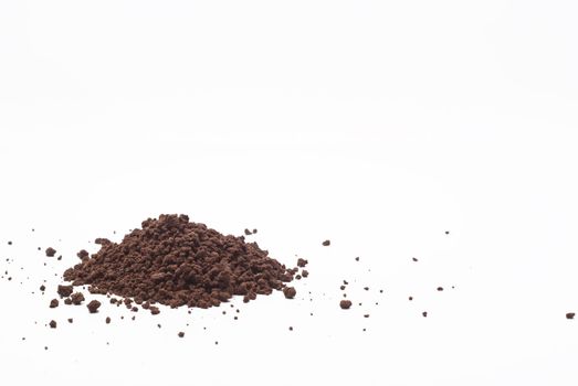 Grains and cocoa powder on a white background.