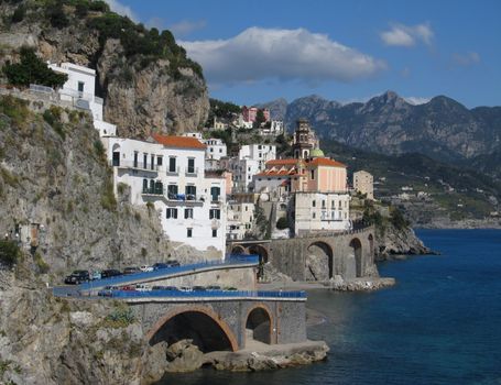 Atrani is the village with the narrowest streets of the whole Amalfi coast in Italy. Sea view shot with the church bell-tower in the distance.