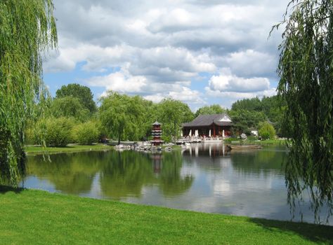 Chinese Tea Pavilion at the lake in The Gardens of The World Park, Berlin.