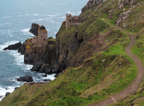 The Botallack Tin Mine ruins preserved on the cliffs above the sea in Cornwall.