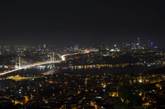 The night view of Bosphorus Bridge seem from camlıca illuminated by purple  led light in Istanbul