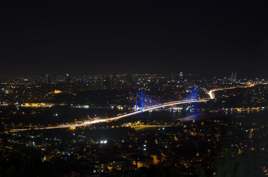 The night view of Bosphorus Bridge seem from camlıca illuminated by purple  led light in Istanbul