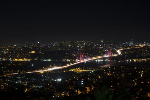 The night view of Bosphorus Bridge seem from camlıca illuminated by purple  led light in Istanbul