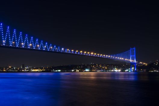 The night view of Bosphorus Bridge seem from camlıca illuminated by purple LED light in Istanbul