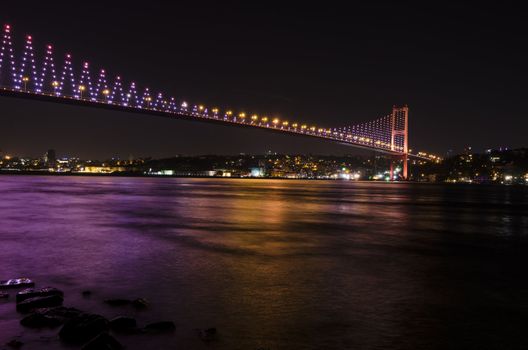 The night view of Bosphorus Bridge seem from camlıca illuminated by purple LED light in Istanbul