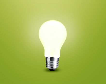 glowing Light bulb idea on green background