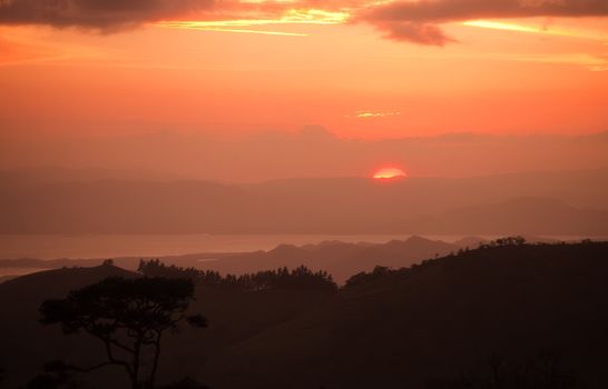 Orange sunset in a Latin American rain forest 