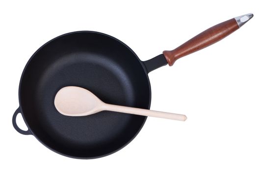 Empty pan with wooden spoon top view. Objects isolated on white background.