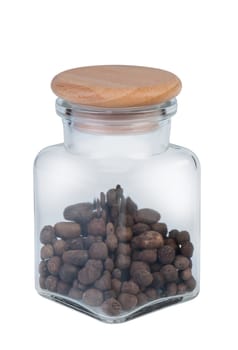 Pepper in a glass jar isolated on white background.