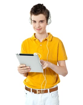 Smart boy using touch screen device against white background
