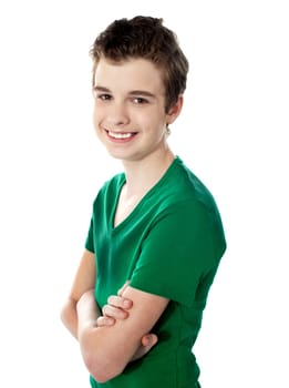 Young boy posing with folded arms isolated against white background
