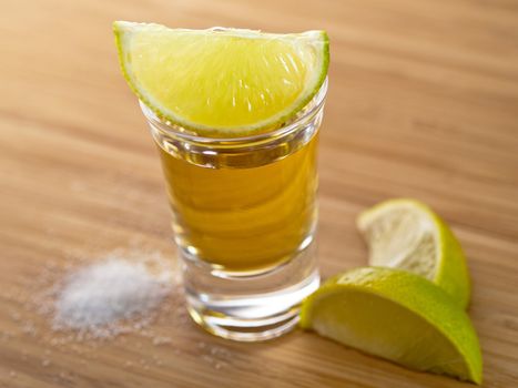 Shot of tequila with salt and lime