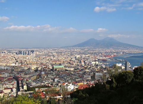 View of Naples in a sunny day with Mount Vesuvius at the background.