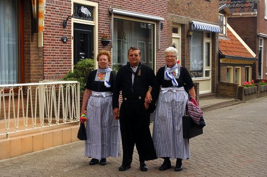 Volendam local residents dressed in traditional costume of Holland. Volendam - an old fishing village in Holland