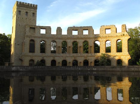 Roman Ruins with reflection at the water surface in Sansoucci Gardens, Potsdam.